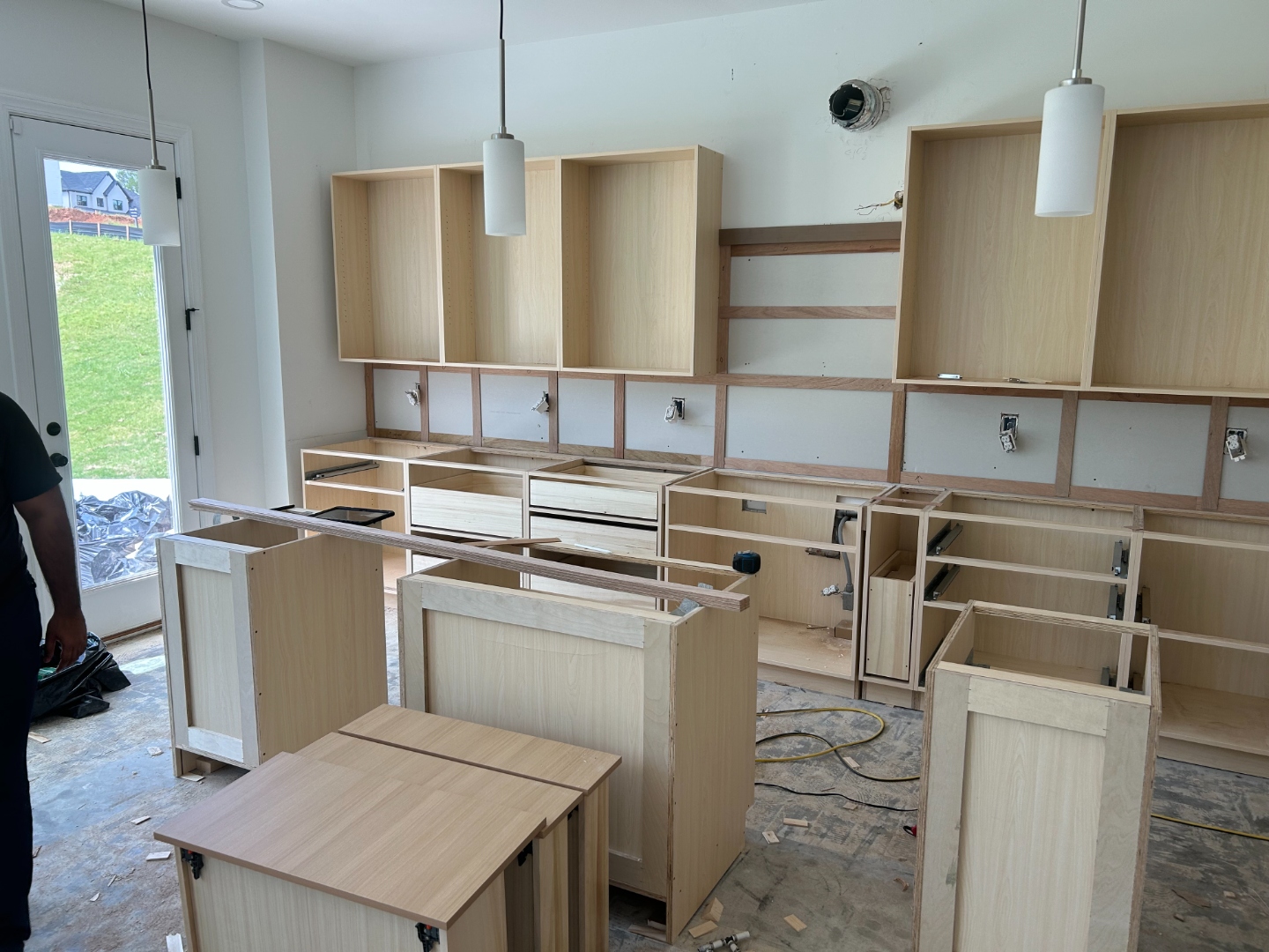 Cabinet and countertop installation in progress for a full kitchen remodel in Cumming, GA