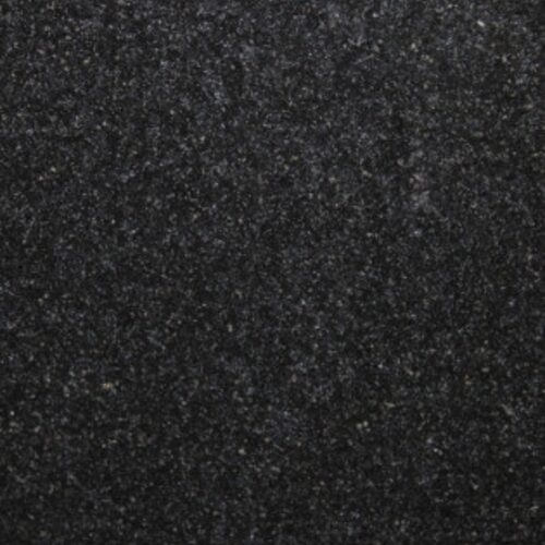 Absolute Black granite slab close-up, solid deep black stone with fine speckling