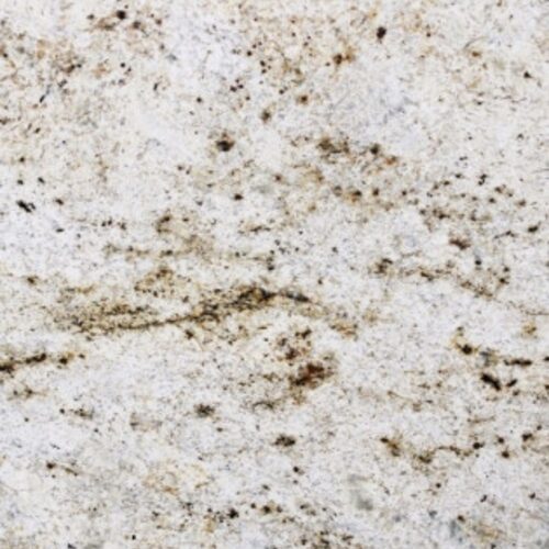 Colonial Gold granite slab close-up, cream and beige stone with rust speckling