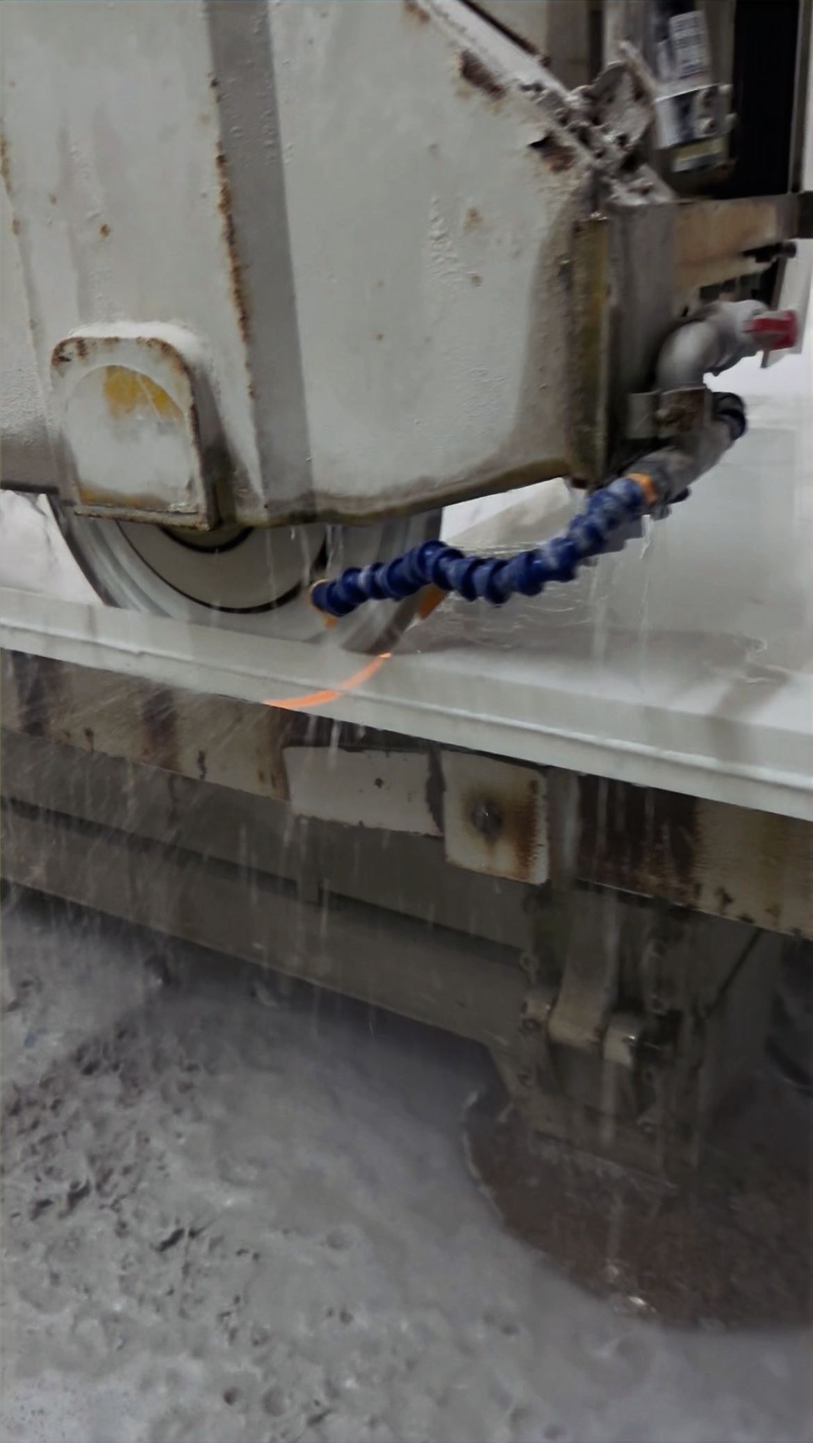 Southeastern Granite Co fabricating a countertop slab with a CNC saw in our shop