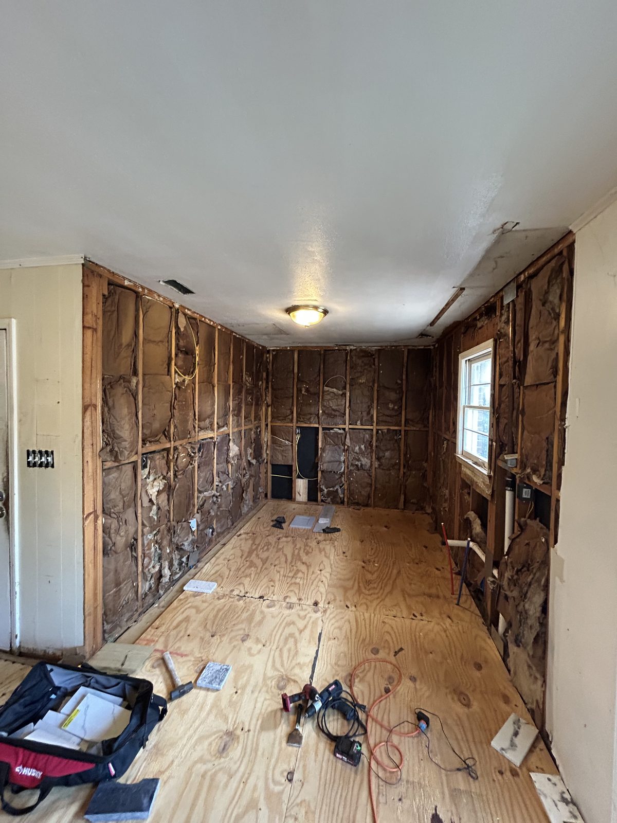 A kitchen taken down to the studs before a full remodel