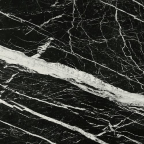 Black Marquina marble slab close-up, black stone with bold white veining