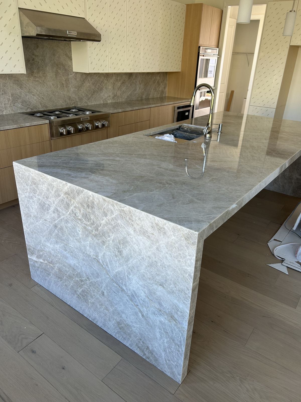 Mitered edge detail on an Australis Blue granite island installed in Sugar Hill, GA