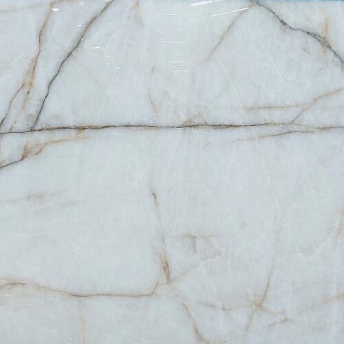 Cristallo Doro quartzite slab close-up, white stone with gold and grey veining