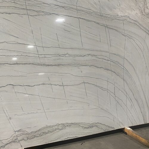 Yosemite quartzite slab close-up, white and grey stone with bold linear veining