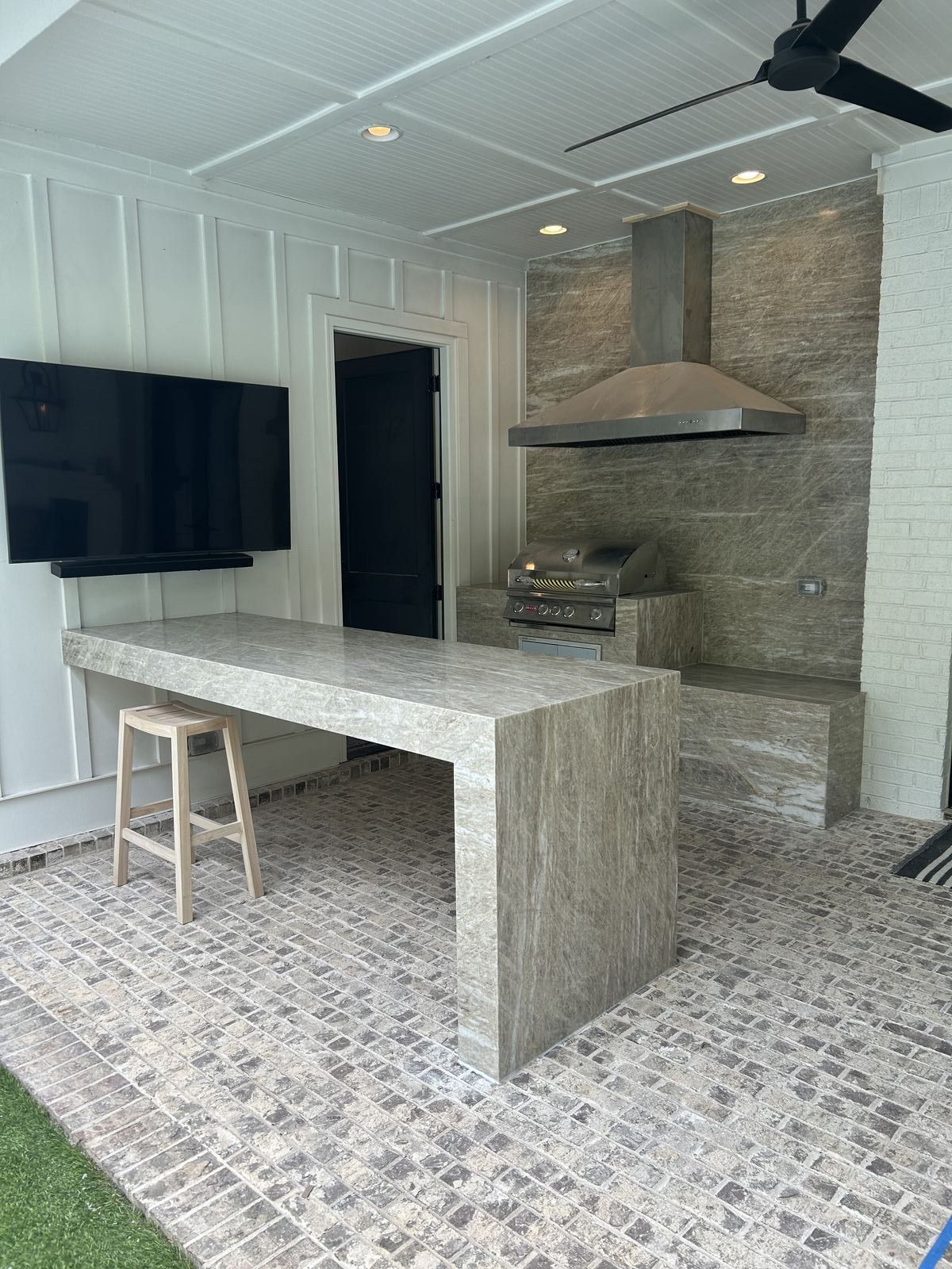 Leathered-finish Taj Mahal quartzite kitchen island installed for a homeowner in Suwanee, GA